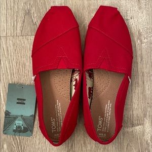 New with tags. Women’s 8.5, Toms shoes, red.